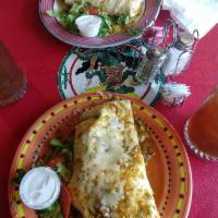 Super Burrito Lunch Special · Filled with rice, beans, lettuce, tomatoes, cheese, sour cream, guacamole and your choice of...