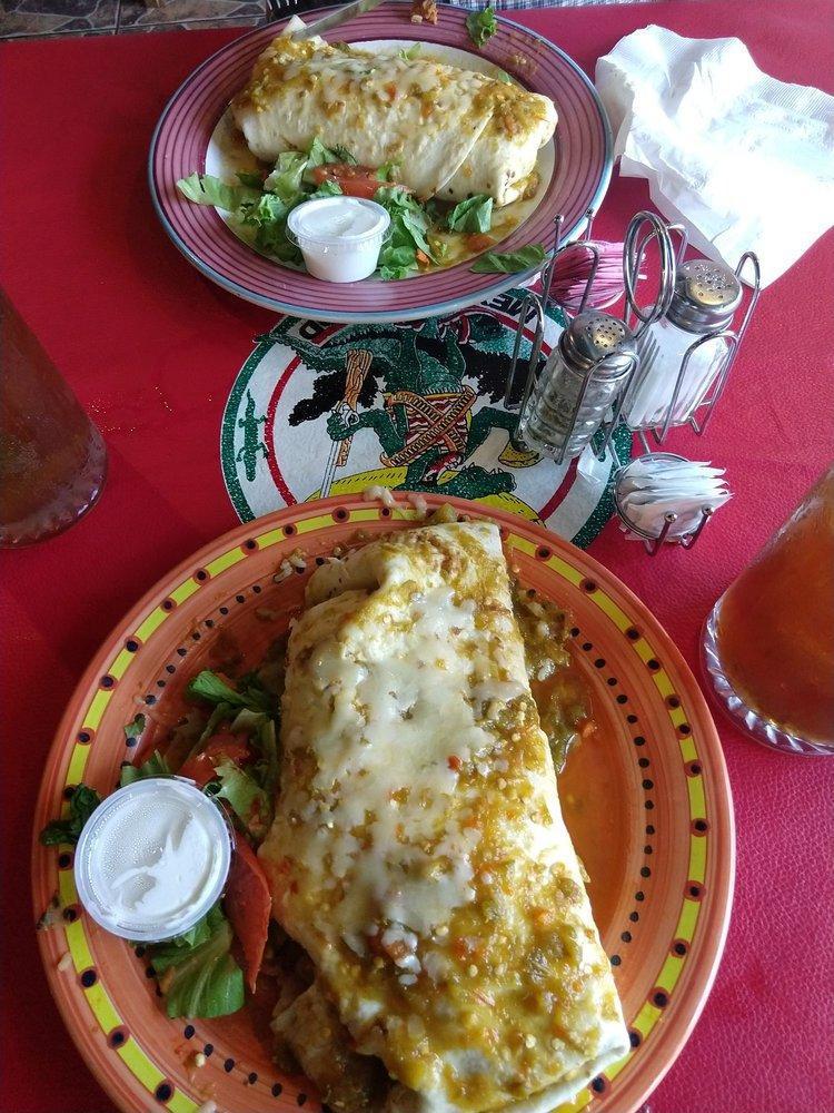 Super Burrito Lunch Special · Filled with rice, beans, lettuce, tomatoes, cheese, sour cream, guacamole and your choice of beef, chicken, pork or veggie. Red chile, green chile or christmas.