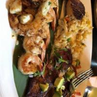 Broiled Seafood Platter · Blackened Fish Fillet, Grilled Shrimp Scampi, Oyster Bar Trash, & Scallops