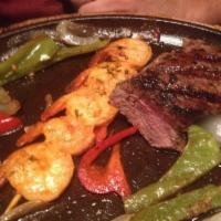 Steak and Shrimp · Two southwest seasoned skewers of shrimp paired with a seasoned 9 oz. sirloin steak, served ...