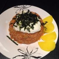 Kimchi Fried Rice · Fried rice with spam, kimchi and onions topped with a fried egg and shredded seaweed.