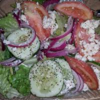Greek Salad · Tomato, cucumbers, olives, onions, feta cheese, oil and vinegar over romaine lettuce.