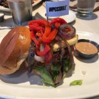 Impossible Burger · Impossible™ Burger, herbed goat cheese, organic mixed greens, tomatoes, grilled red onions, ...