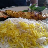 Chicken Kabob · Breast of chicken is marinated and charbroiled with tomato, served with rice and yogurt sauce.