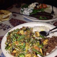 Gyros Platter · Strips of gyros are grilled with Persian spices and served with fresh veggies, herbs, yogurt...