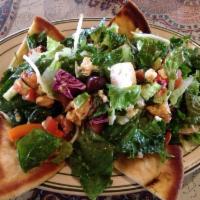 Spicy Chicken Herb Salad · Fresh salad served with grilled breast of chicken with a touch of feta cheese and house dres...