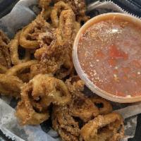 Fried Calamari · Tender calamari dredged in seasoned flour and flash fried. Served with a fra diavolo sauce.