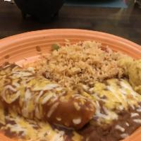 Carnitas · Slow cooked, marinated pork served with frijoles de la olla, Mexican rice, pico  de gallo, g...