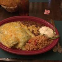 Tomatillo Chicken Enchiladas · 2 enchiladas stuffed with chicken and topped with tangy green tomatillo salsa and Monterrey ...