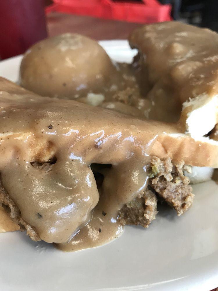 Meatloaf · 2 thick slabs of homemade meatloaf, topped with fresh brown gravy. Served with 2 sides and lovely dinner rolls.