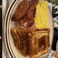 French Toast Deluxe · 3 pieces with ham, bacon, sausage and 2 eggs.