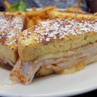 Monte Cristo Sandwich · Dipped in egg batter with a sprinkle of powdered sugar, fresh sliced turkey and melted Swiss...