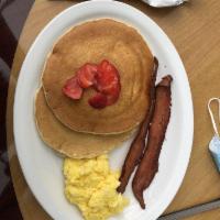 Pancake Combo · 2 pancakes, 2 eggs, and a choice of 2 link sausage or 2 strips of bacon.
