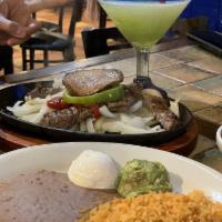 Fajitas · Includes tortillas, guacamole, sour cream, rice and beans. ( Steak, Chricken, or Combo Jumbo...