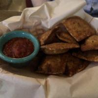 Toasted Ravioli · Straight from IMO's in st. Louis, 8 beef filled ravioli served with marinara.