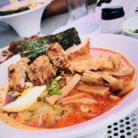 Curry Ramen · Spicy curry broth with pork belly, scallions, bamboo, nori and egg.