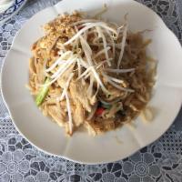 Pad Thai · Traditional rice noodles stir fried with bean sprouts, scallions, crushed peanuts and egg.
