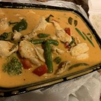 Panang · Your choice of beef or chicken cooked in coconut-peanut curry sauce with basil.