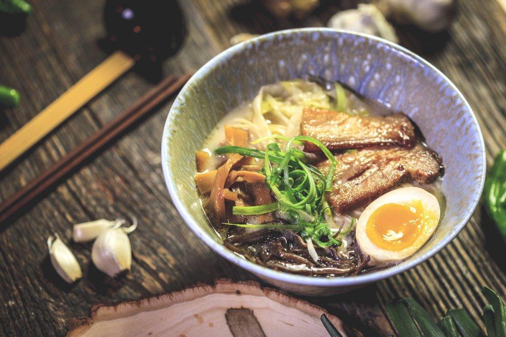 Tonkotsu Ramen · Rich, creamy, 12-hour pork bone broth with braised pork belly, bamboo shoot, egg, wood ear, sauteed cabbage and scallions.