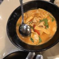Red Curry · Red curry paste in coconut milk with bamboo shoots, bell peppers and sweet basil. Served wit...