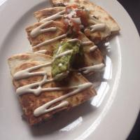 Roasted Pork Quesadilla · Guajillo BBQ sauce and lime habanero pickled red onions. Includes kermes cheese blend, guaca...