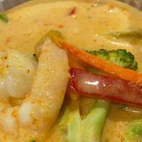 Yellow Curry · Yellow chili paste in coconut milk with potatoes, carrots, and onions.