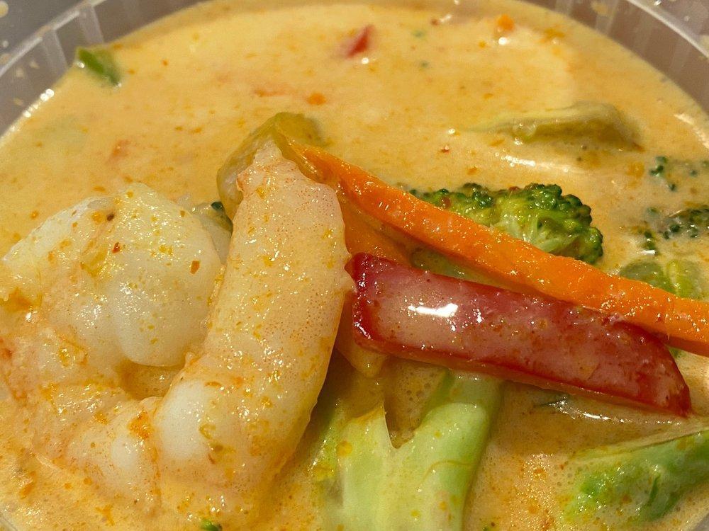 Yellow Curry · Yellow chili paste in coconut milk with potatoes, carrots, and onions.