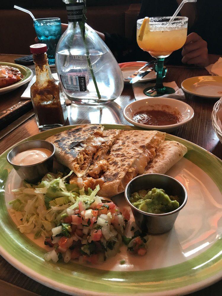 Quesadillas · Grilled flour tortillas filled with choice of protein or cheese, guacamole, pico de gallo and sour cream.