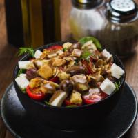 Cherry Tomato Salad · Cherry tomatoes, mozzarella, almonds, croutons and black olives tossed with Italian dressing...