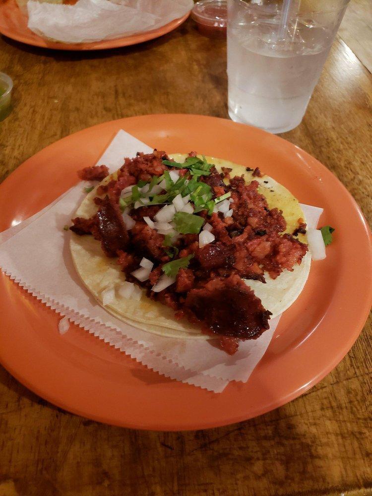 Chorizo Taco · Grilled traditional Mexican sausage, finished with freshly cut white onions and cilantro, lime, radish.