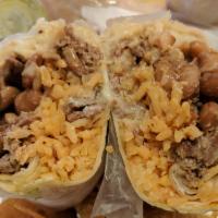 Steak and Chicken Burrito · Mexican rice, pinto beans, lettuce, monterey jack cheese, sour cream, and salsa roja wrapped...