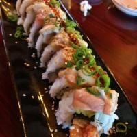 Ranye West Roll · Tempura shrimp and spicy tuna topped with avocado, salmon and jalapeno. Torched and sauced w...