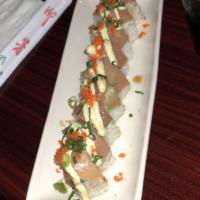 Sushi Bae Roll · Spicy tuna, cucumber and tempura shrimp. Topped with shiro maguro and avocado. Finished with...