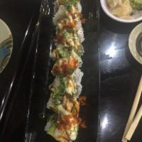 Knee Deep Roll · Tempura shrimp and crab mix topped with avocado and scallop torched and garnished with our s...