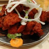 Chicken 65 · Cubes of boneless chicken. A modern day classic in India. Spicy.