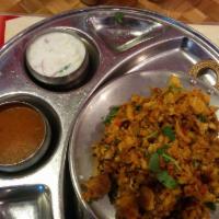 Chicken Kothu Parotta · South Indian parotta chopped and cooked with vegetables, onions, tomatoes. Comes with onion ...
