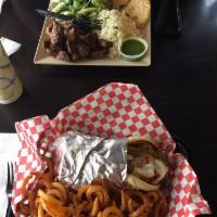 Gyro Philly Wrap · Marinated grilled lamb beef served with grilled bell peppers and onions topped off with Mozz...