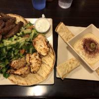 Combo Platter · Marinated chicken kebab and grilled lamb beef gyro served over our seasoned basmati rice and...