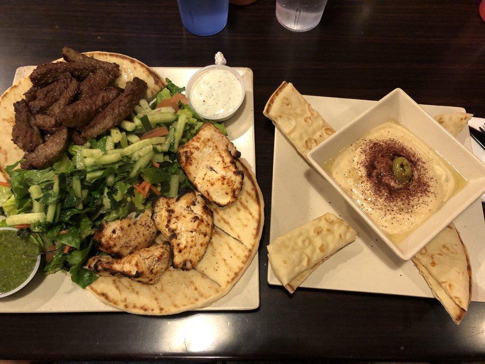 Combo Platter · Marinated chicken kebab and grilled lamb beef gyro served over our seasoned basmati rice and warm pita with a side of our salad and Tzatziki & Chutney sauce 