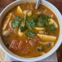Tom Yum Soup · The traditional Thai soup with lemongrass, galangal, mushroom, onion, tomatoes, cilantro and...