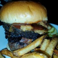 Brisket Burger · 6oz Hand padded burger topped with our smoked brisket onion petals house barbecue sauce on a...