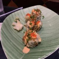 Buckhead Roll · Fried roll smoked salmon, eel, shrimp tempura, spicy crab mix, cream cheese, avocado and cuc...
