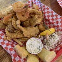 Seafood Platter · Large tail-on shrimp, strips of fried catfish and crispy fried oysters. Served with seasoned...
