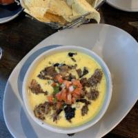 Brisket Queso · House smoked brisket, BBQ queso. Served with house-fried tortilla chips.