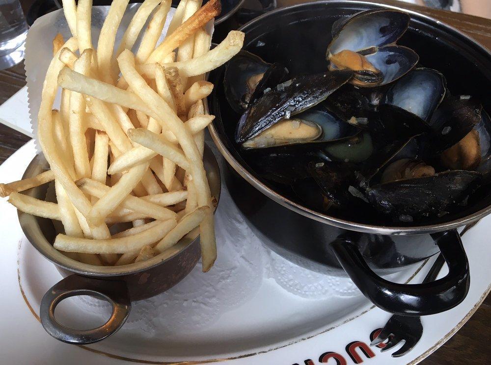 Moules Frites · Mussels, white wine, shallots fines herbes, pommes frites
