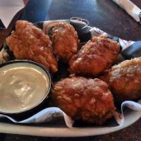 Armadillo Eggs · Chicken, diced jalapenos, pepper jack, cream cheese, secret sauce and seasonings, rolled in ...