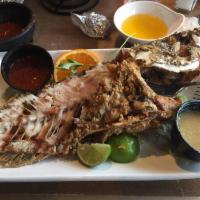 Pescado · Whole red snapper dipped in special batter and lightly crisp. Served with your choice of hot...