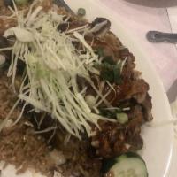 Roast Duck Fried Rice · Peking style duck on top of fried rice. Can be regular or spicy duck (refried with scallions...