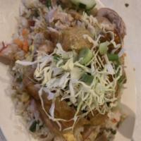House Special Fried Rice with Lamb · Fried rice with shrimp, crab meat, and lamb inside and fried quarter chicken on top