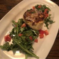 Crab Cake · Fresh lump blue crab cake, served on a bed of arugula, with lemon garlic cream or roasted re...